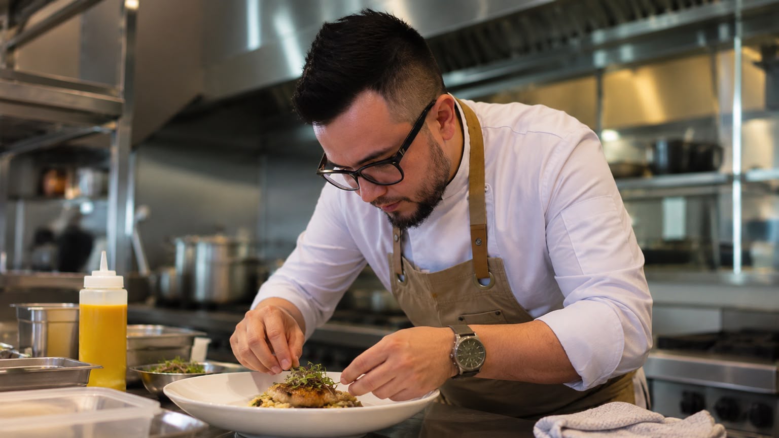 NGM Catering chef preparing a plated dish